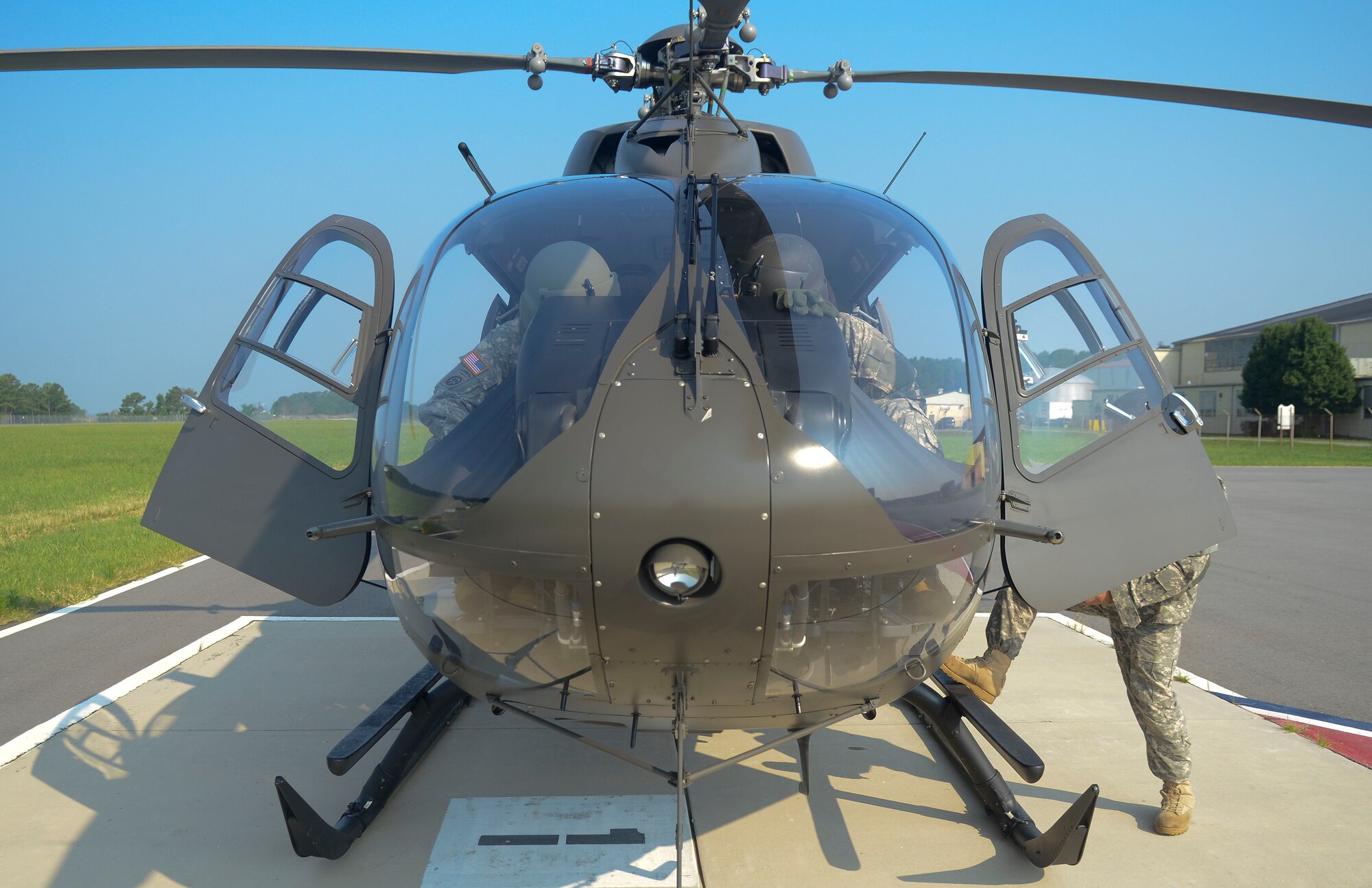 U.S. Army Chief Warrant Officer 4 Todd Saville and Rob Schoerner, both Training and Doctrine Command flight detachment pilots, prepare their UH-72A helicopter for flight at Fort Eustis, Va., July 19, 2013. The crew for the TRADOC flight detachment UH-72A light utility helicopters is normally comprised of a pilot, co-pilot and crew chief, with the capability to carry five passengers. (U.S. Air Force photo by Airman 1st Class Austin Harvill/Released)