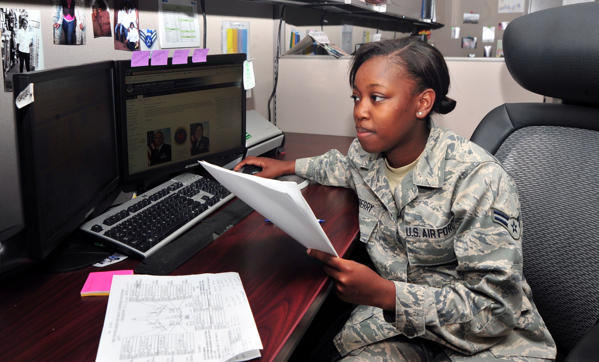Airman 1st Class Jundra Asberry, 22nd Maintenance Operations Squadron management production journeyman, checks maintenance forms for an aircraft July 25, 2013, at McConnell Air Force Base, Kan. The forms track any and all maintenance that has been performed on the KC-135 Stratotankers stationed here at McConnell AFB. (U.S. Air Force photo/Airman 1st Class Colby L. Hardin)