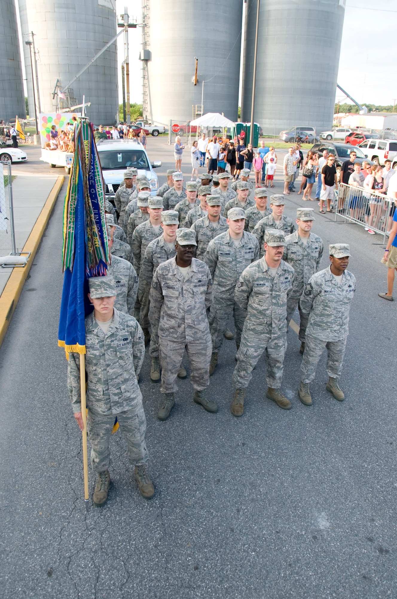 A group of Team Dover Airmen stand in formation July 24, prior to marching in a parade at the Delaware State Fairgrounds in Harrington, Del. More than 30 Airmen volunteered to march in the parade that was part of Armed Forces Day at the Delaware State Fair. (U.S. Air Force photo/Tech. Sgt. Jeremy Larlee)