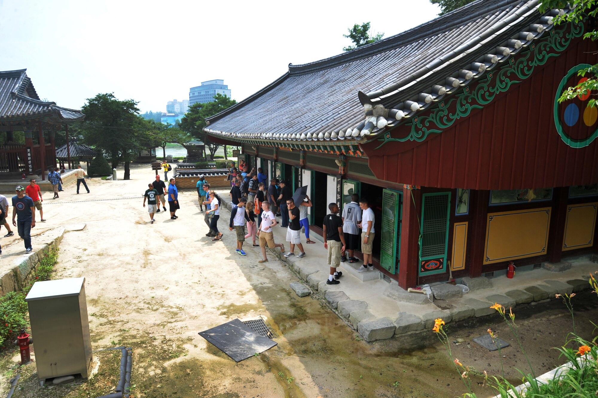 Participants in the Yeoju cultural tour walk through temple buildings at the Sillueksa Temple in the Gyeonggi Province, Republic of Korea, July 26, 2013. This is the only Buddhist temple in the ROK that is located beside a river instead of on top of a mountain. (U.S. Air Force photo/Staff Sgt. Emerson Nuñez)
