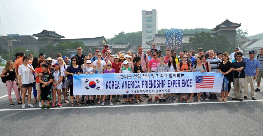 Participants in the Yeoju cultural tour from Osan Air Base gather for a group photo at the Yeoju Ceramic Center in the Gyeonggi Province, Republic of Korea, July 26, 2013. The cultural tour, sponsored by the Korea America Friendship Society is offered to all U.S. service members and their families. (U.S. Air Force photo/Staff Sgt. Emerson Nuñez)