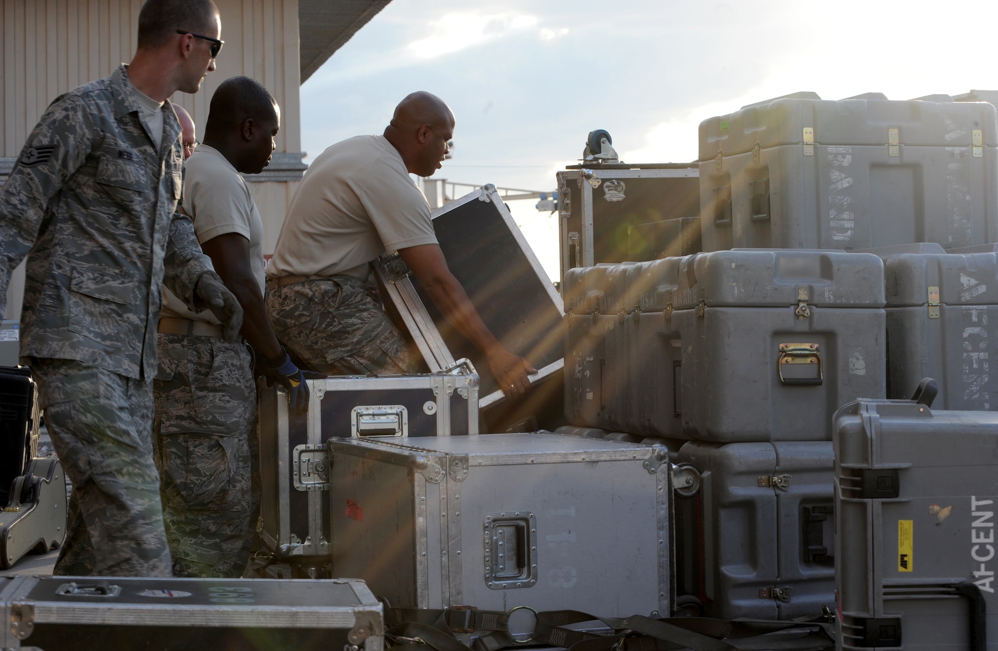 U.S. Air Forces Central Command band, Full Spectrum, builds a pallet prior to departing Transit Center at Manas, Kyrgyzstan, July 23, 2013. The 10-person band set up and tore down their own equipment, weighing almost two tons. Full Spectrum is deployed from Joint Base Langley-Eustis, Va. (U.S. Air Force photo/Staff Sgt. Krystie Martinez)