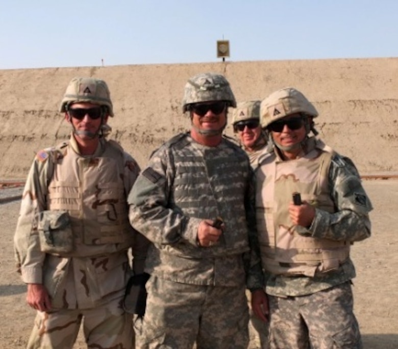 (left to right) Steve Herman, Little Rock District; Keith Loos, Little Rock District; Russ Wallace, Galveston District and Harrison Sutcliffe, Southwestern Division head out to the rifle range in Afghanistan.