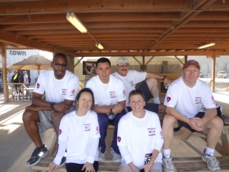 Keith Loos, Little Rock District and Russ Wallace, Galveston District (top-right) relax with the rest of the Transatlantic Afghanistan District Real Estate staff after the 5K "Race for the Cure".