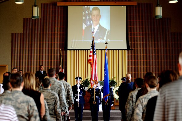 The 319th Air Base Wing Honor Guard presents the colors during a memorial service for Tech. Sgt. Matthew Hullman on July 30, 2013, at Grand Forks Air Force Base, N.D. Hullman was declared dead following a shooting incident on July 21, and the incident remains under investigation.  (U.S. Air Force photo by Staff Sgt. Amanda N. Grabiec)