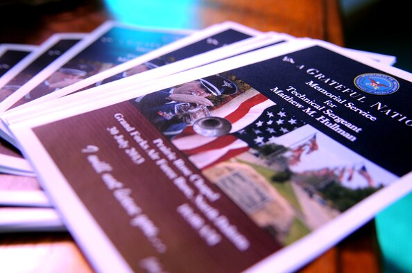 Grand Forks Air Force Base, N.D., community members gather July 30, 2013, at a memorial service for Tech. Sgt. Mathew Hullman, of the 319th Medical Operations Squadron. Hullman was declared dead following a shooting incident on July 21, and the incident remains under investigation.  (U.S. Air Force photo by Staff Sgt. Amanda N. Grabiec)