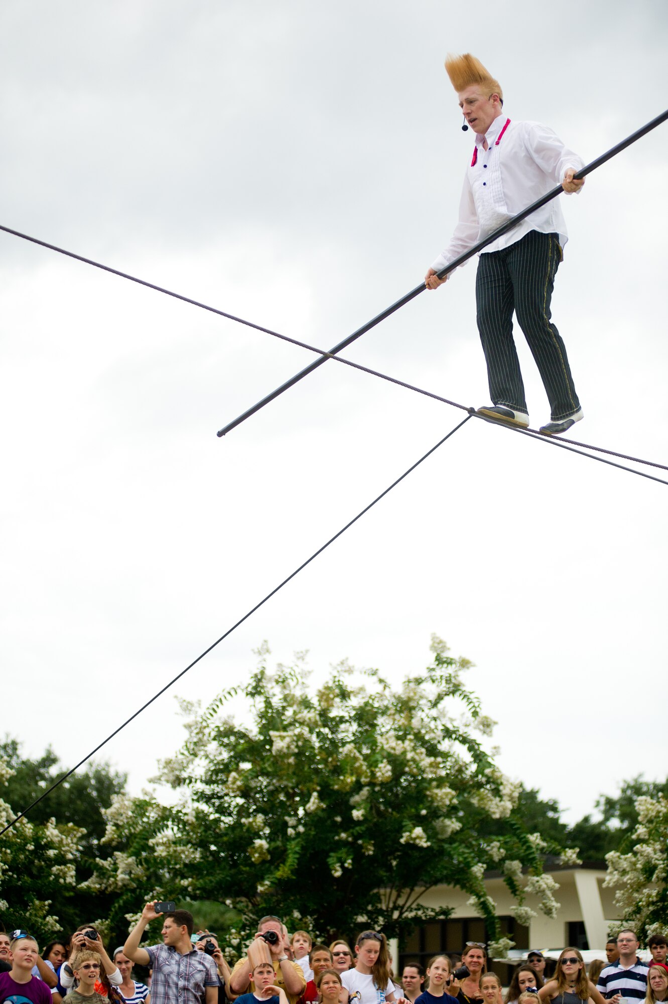 Bello Nock advances along a high wire during a military appreciation performance of Funambula, July 27, 2013, at Welch Theater, Keesler Air Force Base, Miss. Funambula is a theatrical circus act including many acrobatic acts as well as contortionists. (U.S. Air Force photo by Adam Bond)