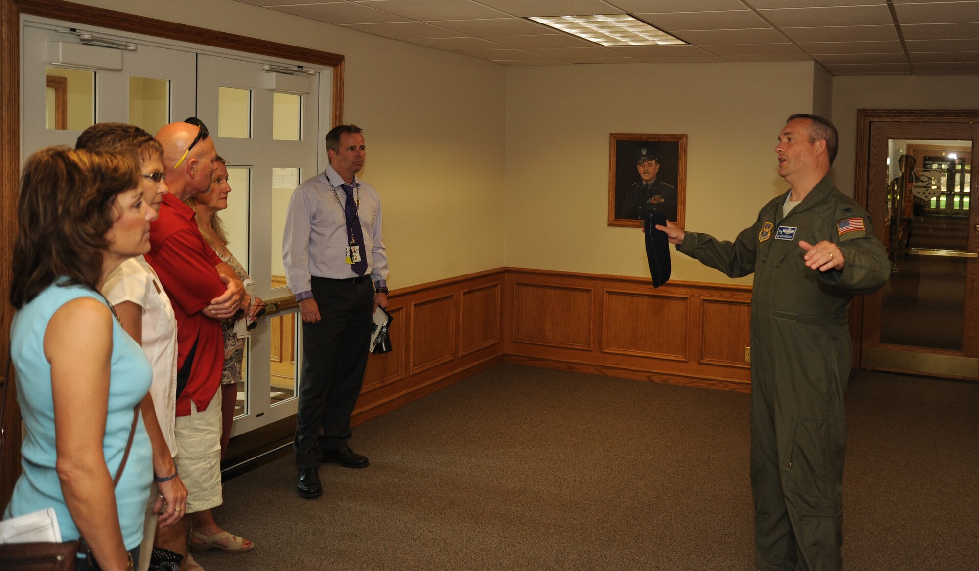 Col. Brian Newberry, 92nd Air Refueling Wing commander, welcomes visitors from the Post Falls, Idaho, Chamber of Commerce to the wing headquarters at Fairchild Air Force Base, Wash., July 26, 2013.  The Post Falls Chamber of Commerce visited the base to observe its operations.  (U.S. Air Force photo by Airman 1st Class Sam Fogleman/Released)