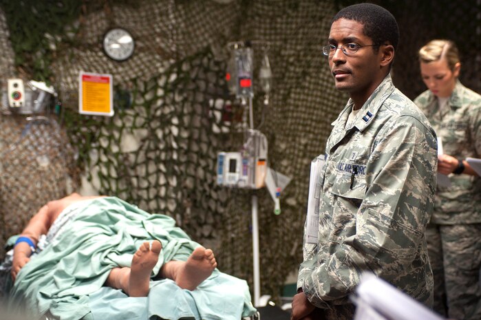 U.S. Air Force Capt. (Dr.) Prentice Bowman, 99th Medical Operations Squadron internal medicine physician , waits to begin an advanced cardiac life support training simulation with the use of high fidelity mannequins at the Nellis Medical Simulation Center July 29, 2013, at Nellis Air Force Base, Nev. ACLS training conducted at the Nellis Medical Simulation Center allows Airmen to put their medical knowledge and skills to the test with the use of high fidelity mannequins that can simulate breathing, heart tones, bleeding and speaking. (U.S. Air Force photo by Staff Sgt. Christopher Hubenthal)