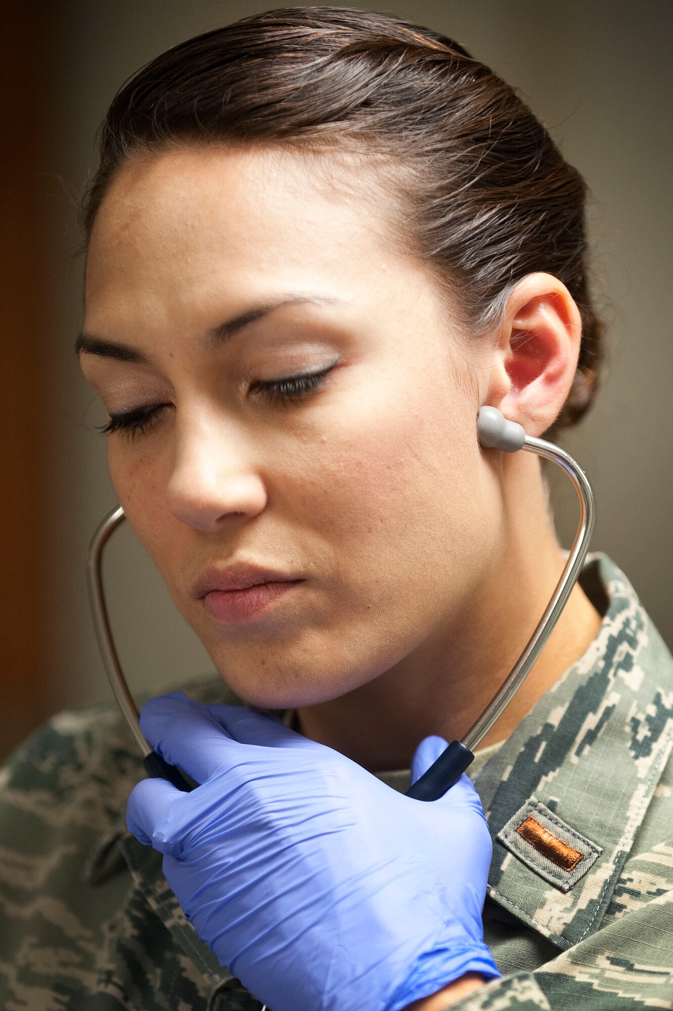 U.S. Air Force 2nd Lt. Theresa Jacobs-Brunner, 99th Inpatient Operations Squadron clinical nurse, listens to the heartbeat of an infant simulated high fidelity mannequin with the use of a stethoscope during Neonatal Resuscitation Program training July 23, 2013, at Nellis Air Force Base, Nev. Simulation allows students to make mistakes and see the consequences of their actions without causing injury or death to a real patient. (U.S. Air Force photo by Staff Sgt. Christopher Hubenthal)