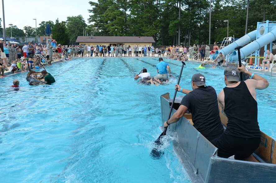 Team Shaw service members compete in a Cardboard Regatta boat race  during the Junior Enlisted Appreciation Celebration at Shaw Air Force Base, S.C., July 26, 2013. Team Shaw units built boats out of cardboard and duct tape (U.S. Air Force photo by Airman 1st Class Krystal M. Jeffers/Released)
