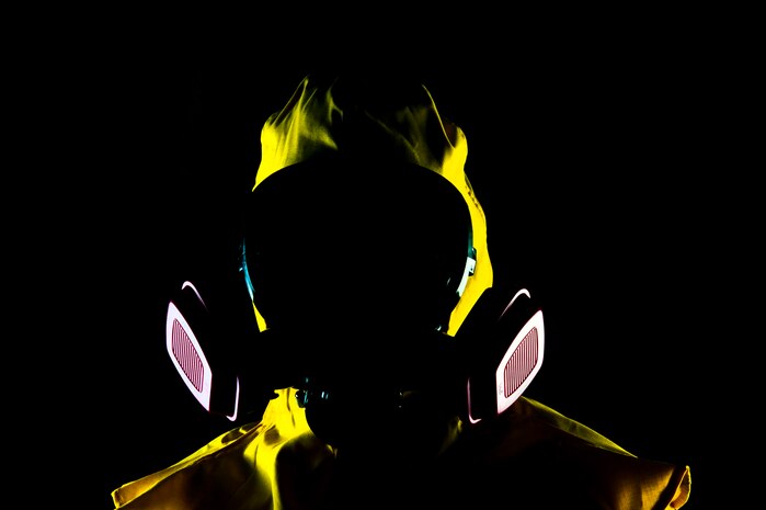 U.S. Air Force Senior Airman Nicholas Johnson, 99th Aerospace Medicine Squadron bioenvironmental engineer journeyman, wears a radiation suit that is used by bioenvironmental engineering first responders during emergency response in the event of a radioactive mishap July 23, 2013, at Nellis Air Force Base, Nev.  In addition to conducting gas mask fit tests, bioenvironmental engineers are also first responders during mishaps and provide direct support to commanders on environmental health situations that could result in sickness or death. (U.S. Air Force photo by Senior Airman Daniel Hughes)