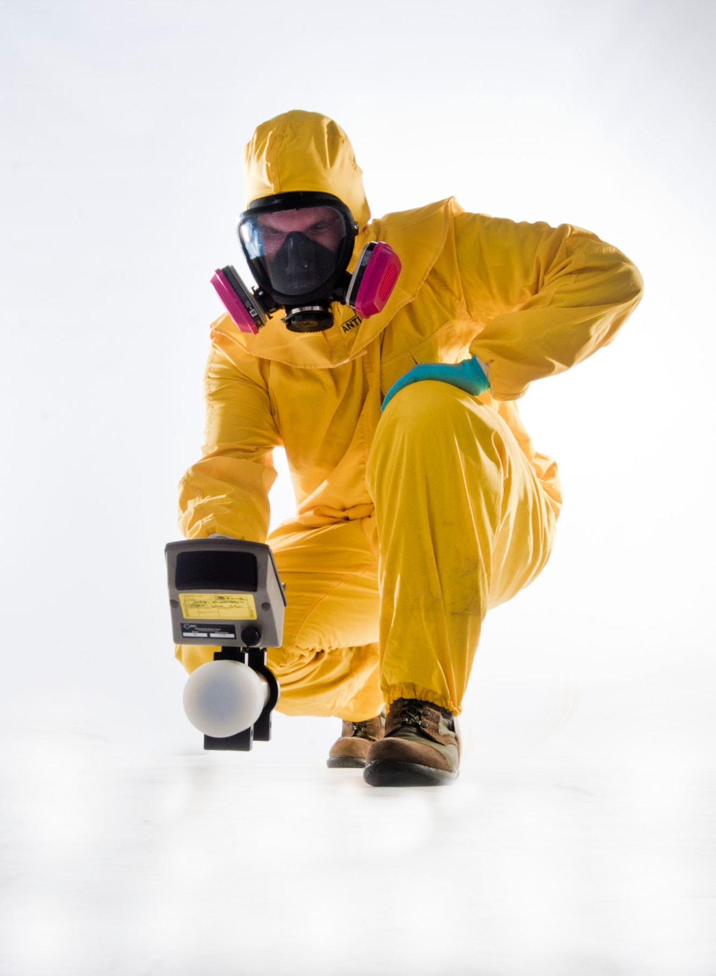 U.S. Air Force Senior Airman Nicholas Johnson, 99th Aerospace Medicine Squadron bioenvironmental engineer journeyman, wears a radiation suit and holds a radiation scanner used by bioenvironmental engineering first responders during an emergency response in the event of a radioactive mishap July 23, 2013, at Nellis Air Force Base, Nev. The suit protects first responders from radiation when they are searching for areas that may be more contaminated than others. (U.S. Air Force photo by Senior Airman Daniel Hughes)