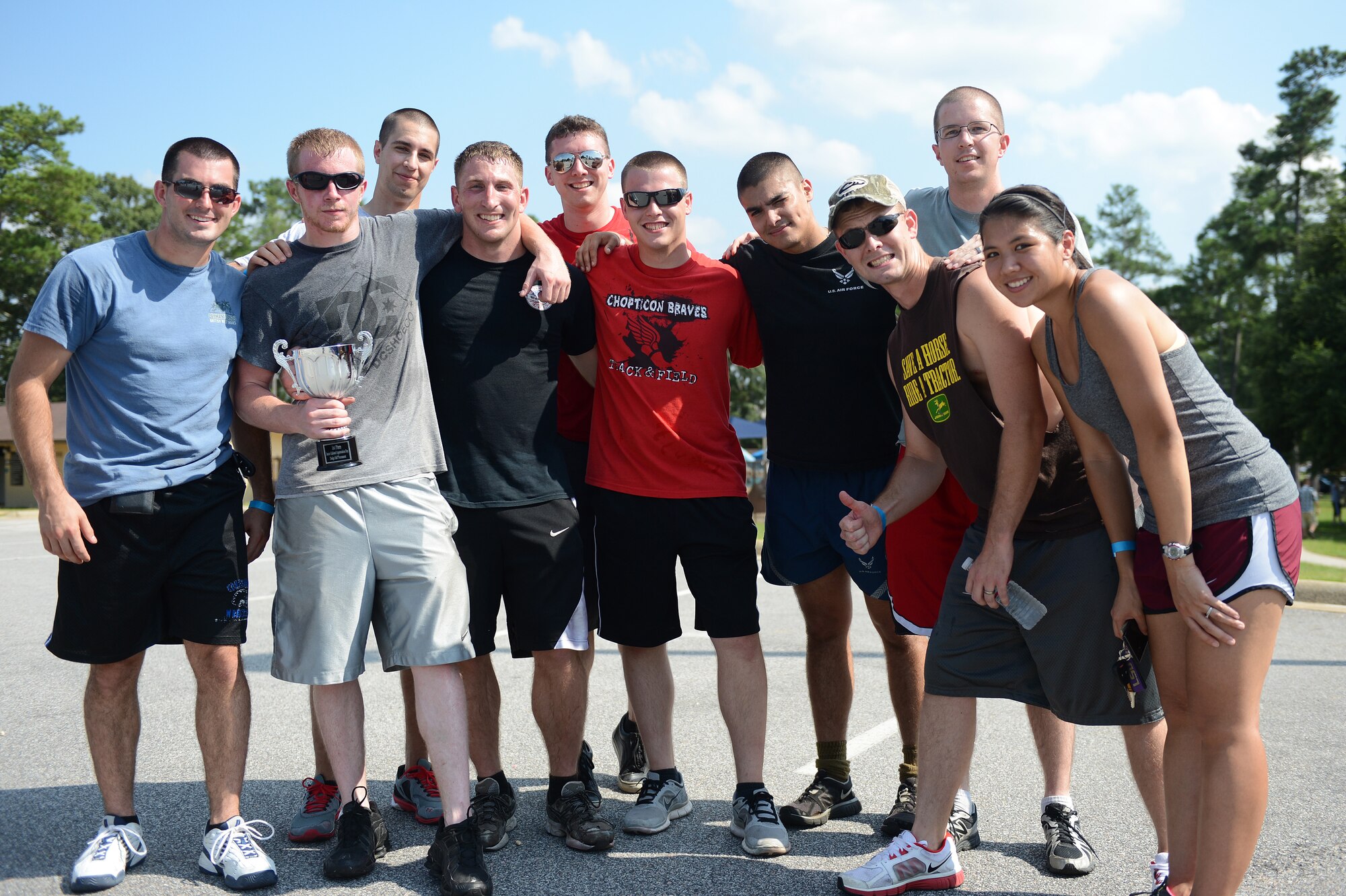 U.S. Air Force Airmen from the 609th Air Operations Center, winners of the Junior Enlisted Appreciation Day dodge-ball tournament, pose with their trophy at Shaw Air Force Base, S.C., July 26, 2013. Shaw’s JEAD honored the work of Airmen and Soldiers, grades E-1 to E-5, for their role in supporting the bases’ missions and daily operations. (U.S. Air Force photo by Airman 1st Class Daniel Blackwell/Released)
