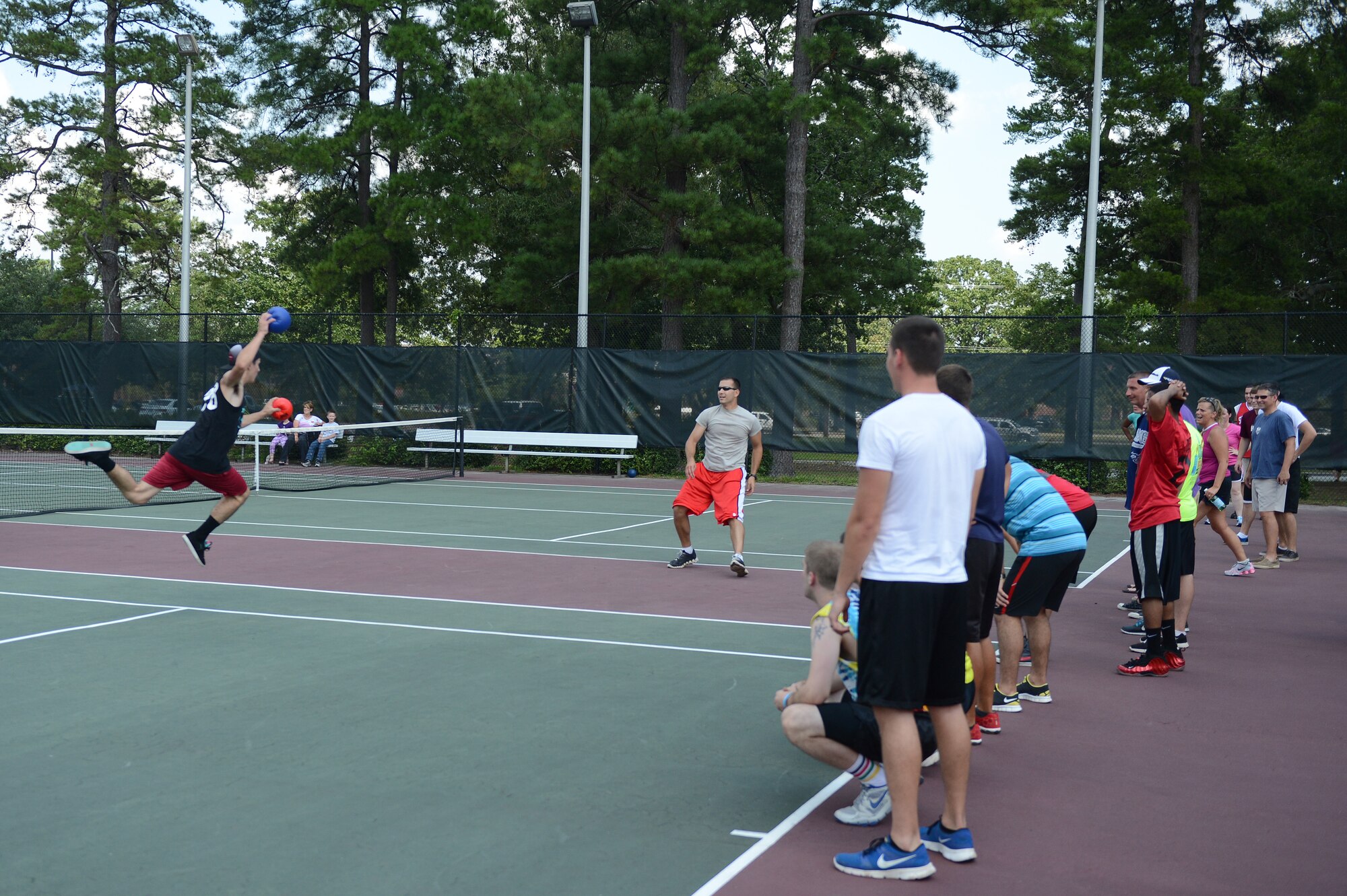 U.S. Air Force Airman 1st Class Kyle Gregory (left), 609th Air Operations Center Detachment 1 air task and order technician, prepares to throw the ball at Capt. Jeremy Kinne, 20th Fighter Wing executive officer, during a game of dodge ball at the Junior Enlisted Appreciation Day, Shaw Air Force Base, S.C., July 26, 2013. Shaw’s JEAD honored the work of Airmen and Soldiers, grades E-1 to E-5, for their role in supporting the bases’ missions and daily operations. (U.S. Air Force photo by Airman 1st Class Daniel Blackwell/Released)