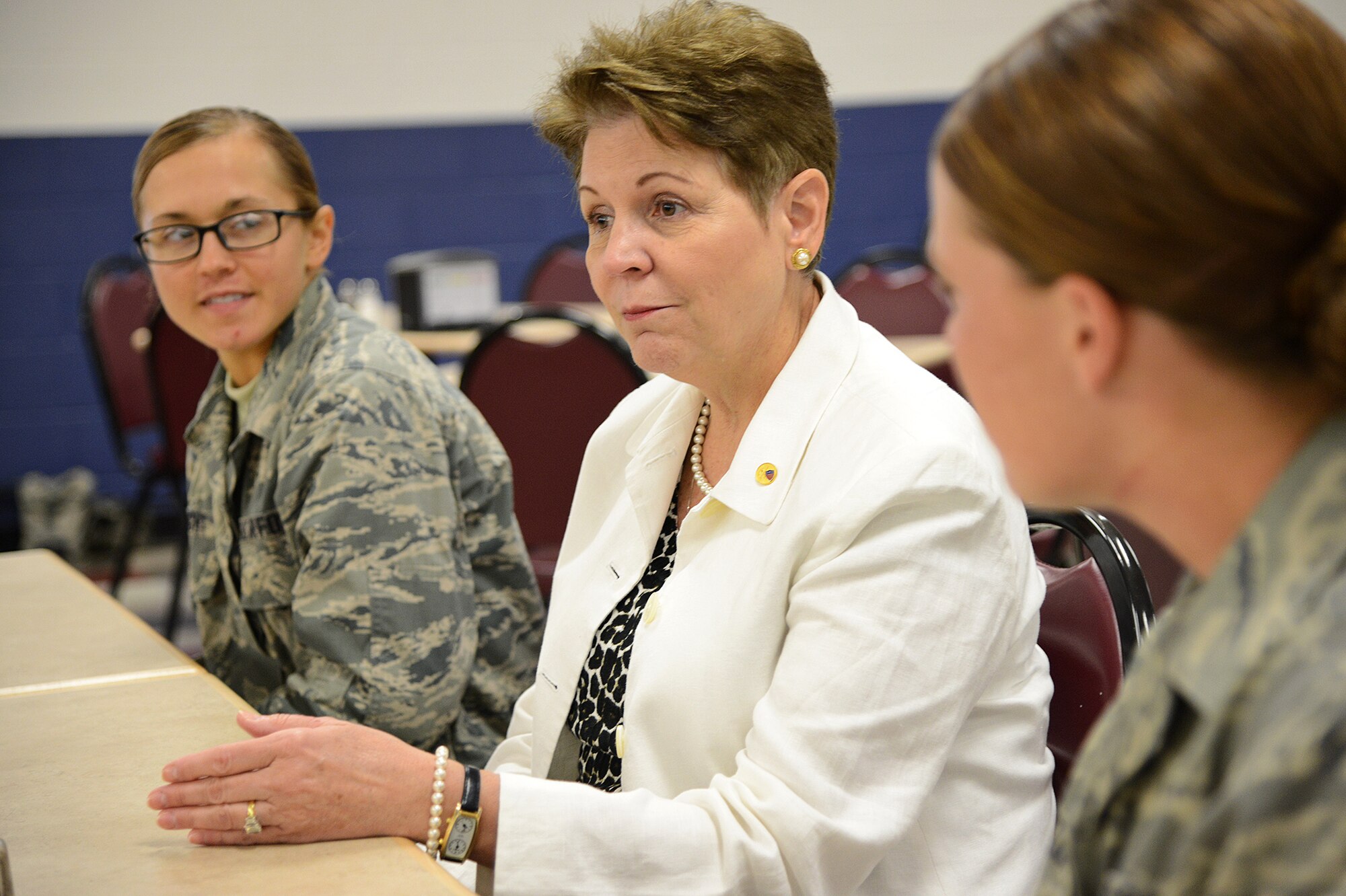 The Honorable Jessica L. Wright, acting under secretary of defense for personnel and readiness, meets with basic training trainees during a roundtable discussion at the cafeteria July 18, at Joint Base San Antonio-Lackland. (U.S. Air Force photo by Benjamin Faske) 
