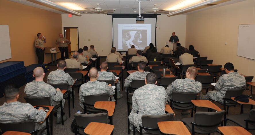 Barry Spinney, Louisiana State Police patrol sergeant, briefs a class of Airmen and Caddo Parish Sheriff police officers on how to conduct standardized field sobriety test training on Barksdale Air Force Base, La., July 23, 2013. Law enforcement from the 2nd Security Forces Squadron and Caddo Parish Sheriff's Office participated in this training to strengthen their ability to apprehend individuals who drive under the influence. (U.S. Air Force photo/Airman 1st Class Benjamin Gonsier)
