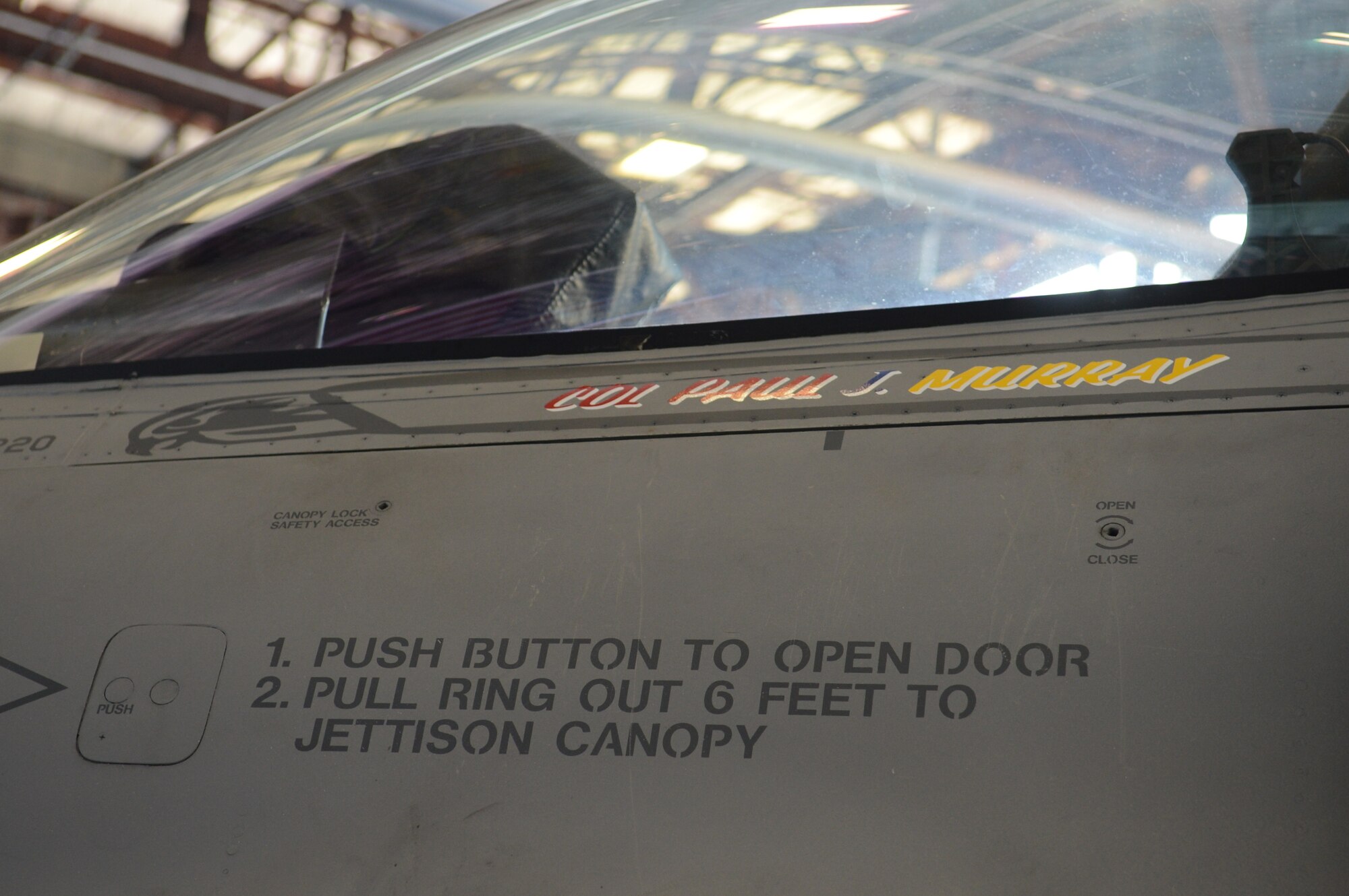 An F-16CJ Fighting Falcon, reveals the name of the new 20th Operations Group commander, U.S. Air Force Col. Paul Murray, after a change-of-command ceremony at Shaw Air Force Base, S.C., July 26, 2013. Murray accepted command of the 20th OG from U.S. Air Force Col. Shaun McGrath, who led the unit for 16 months. (U.S. Air Force photo by Airman 1st Class Jonathan Bass/Released)