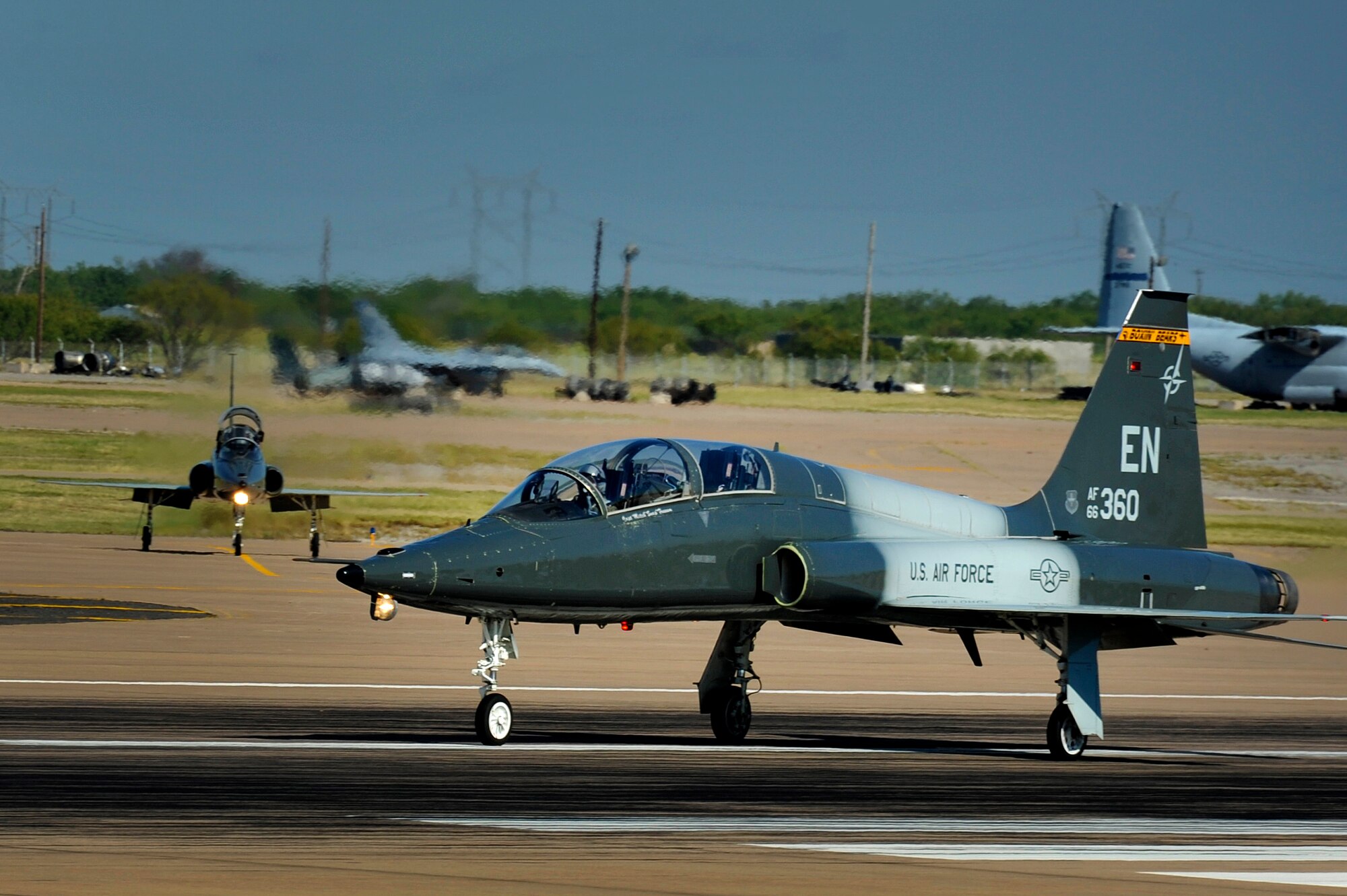 Pilots from the 80th Flying Training Wing, Sheppard Air Force Base, Texas, prepare to take off in a T-38 Talon aircraft during training July 18, 2013. The Talon is a two-seat, twin-engine supersonic jet trainer used to train pilots in the international Euro-NATO Joint Pilot Training Program. (U.S. Air Force Photo/Danny Webb/Released)