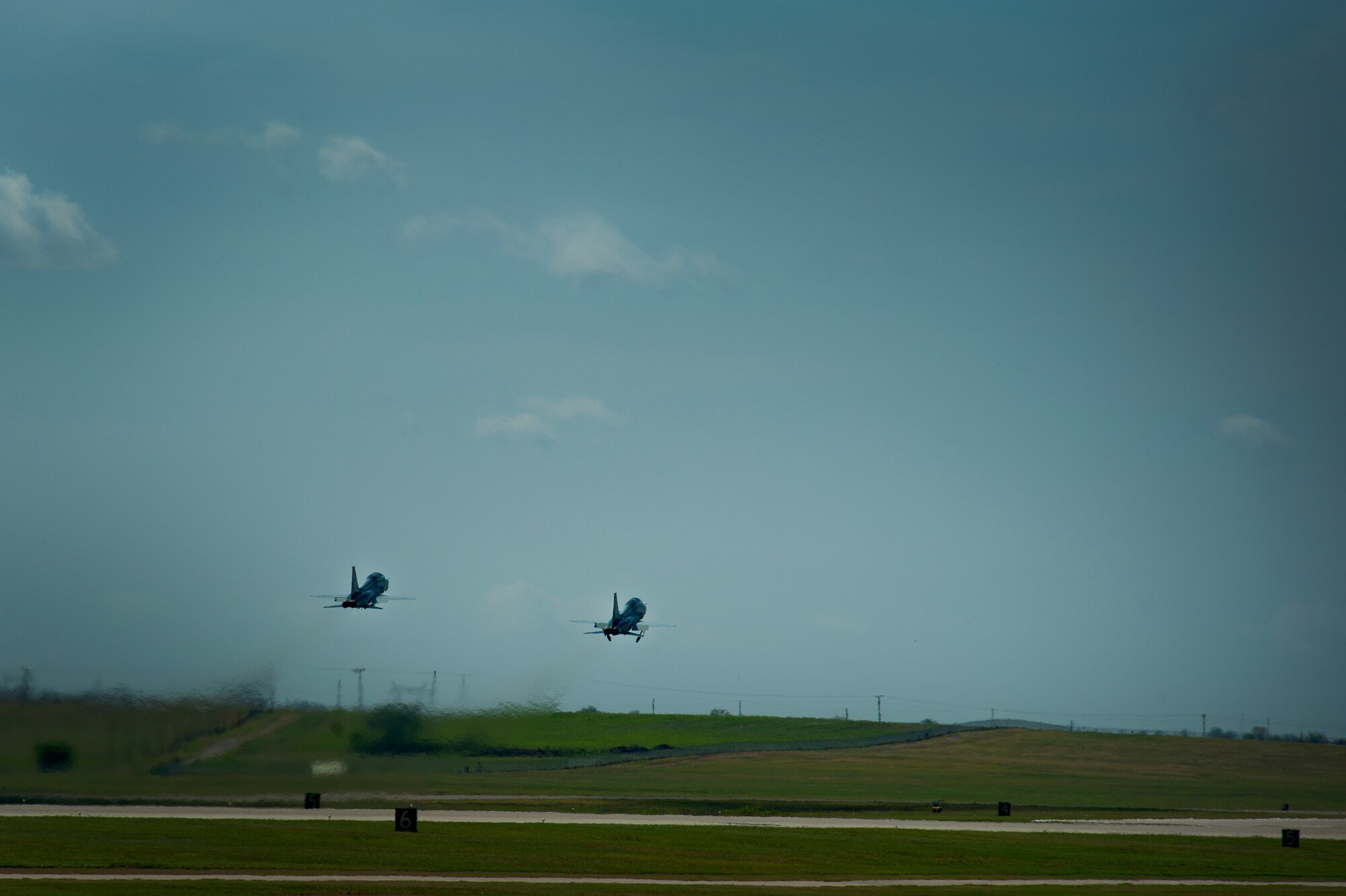 Pilots from the 80th Flying Training Wing, Sheppard Air Force Base, Texas, practice touch and go maneuvers in a T-38 Talon aircraft during training July 18, 2013. The Talon is a two-seat, twin-engine supersonic jet trainer used to train pilots in the international Euro-NATO Joint Pilot Training Program. (U.S. Air Force Photo/Danny Webb/Released)