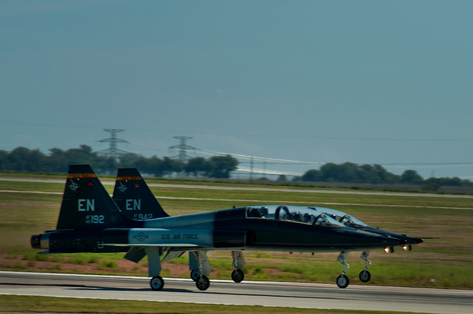 Pilots from the 80th Flying Training Wing, Sheppard Air Force Base, Texas, practice touch and go maneuvers in a T-38 Talon aircraft during training July 18, 2013. The Talon is a two-seat, twin-engine supersonic jet trainer used to train pilots in the international Euro-NATO Joint Pilot Training Program. (U.S. Air Force Photo/Danny Webb/Released)