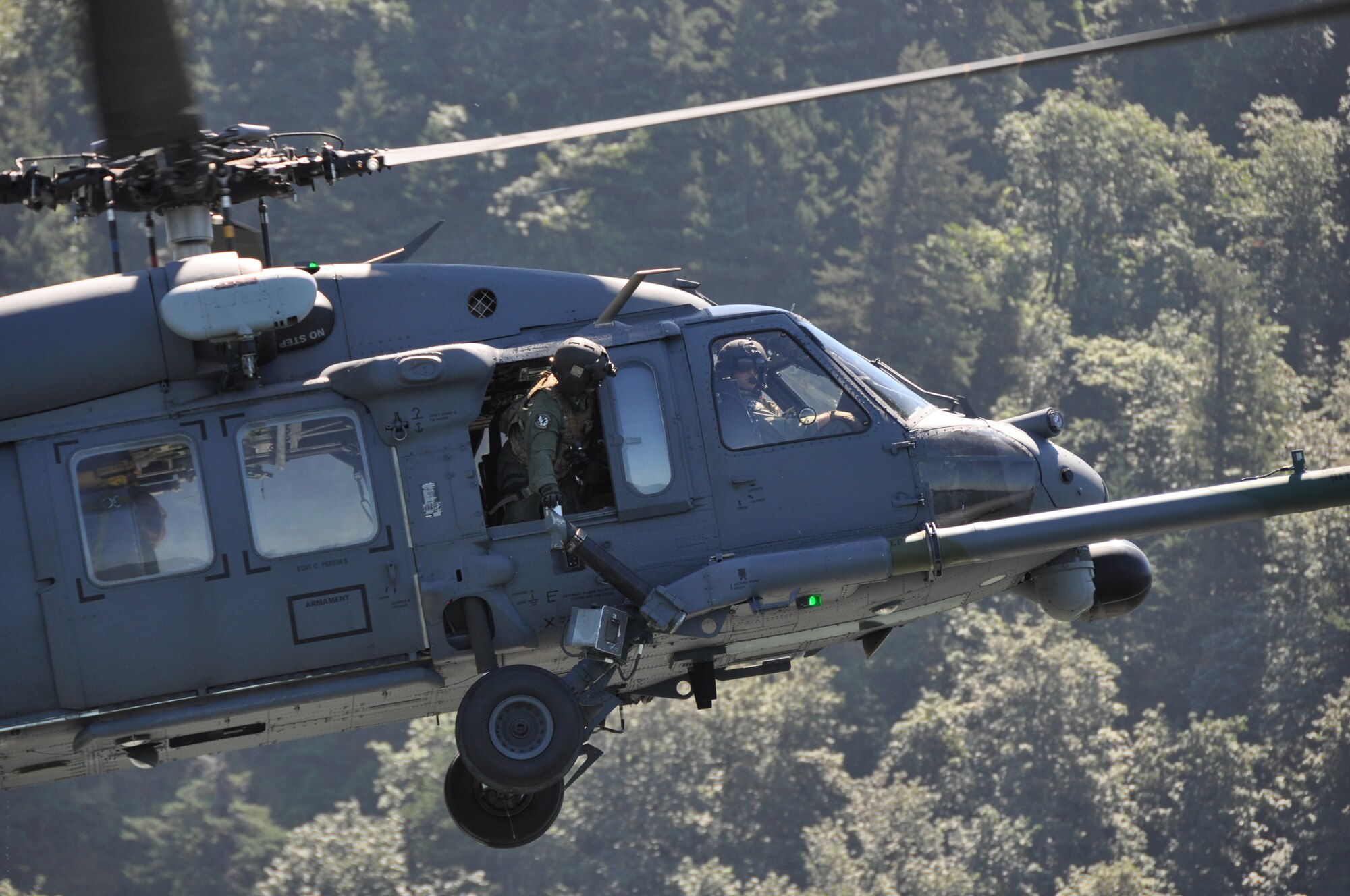 Airmen aboard an HH-60G Pave Hawk helicopter from the 943rd Rescue Group, Davis-Monthan Air Force Base, Ariz., practice water rescue operations with pararescuemen from the 304th Rescue Squadron, Portland International Airport, Ore., in the Columbia River, near Rooster Rock State Park, Ore., July 27, 2013. (U.S. Air Force Photo/Staff Sgt. N. Daniel Delgado)