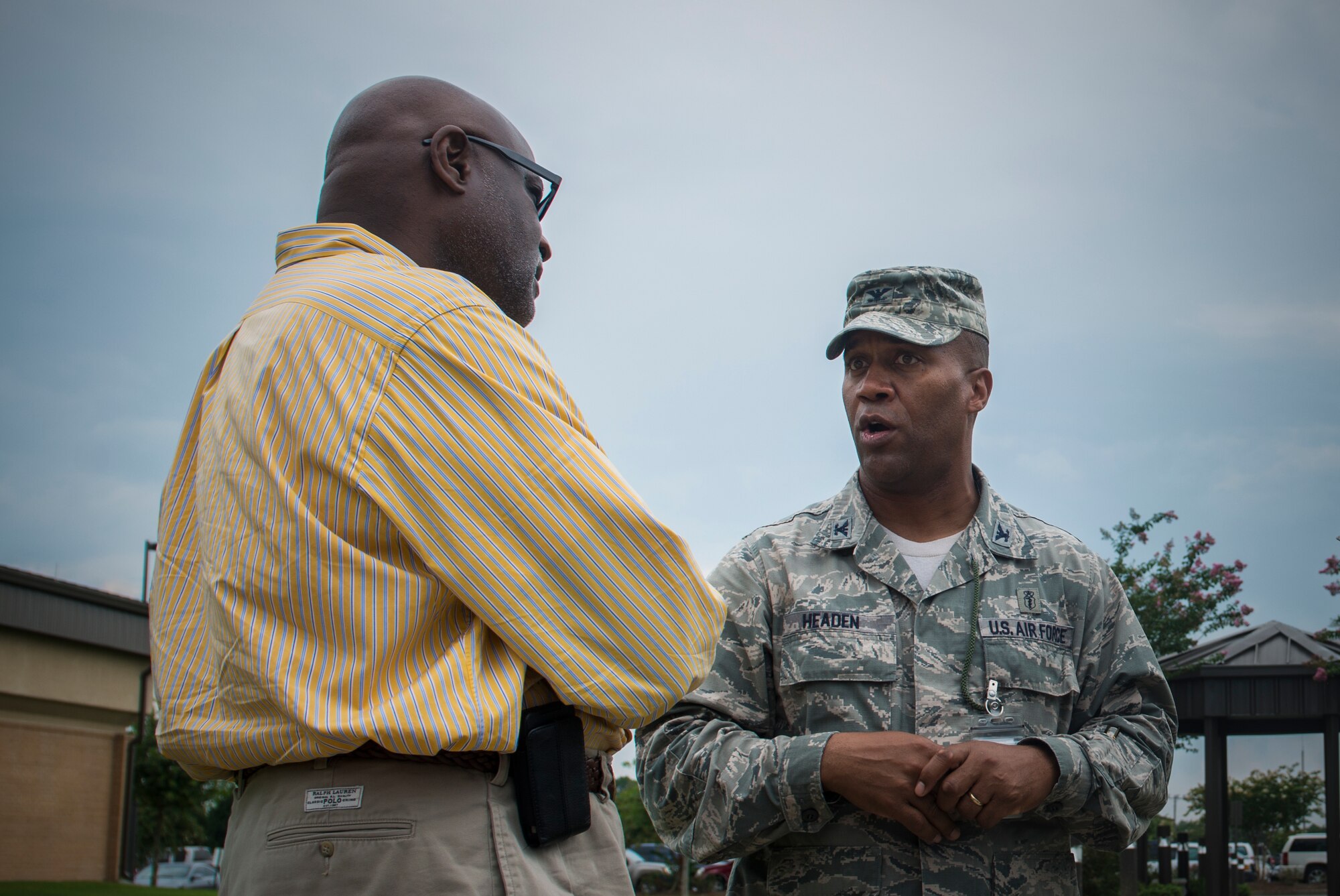 U.S. Air Force Col. Alvis Headen, 23d Medical Group commander, talks with Sam Allen, 23d Component Maintenance Squadron honorary commander, center during immersion day at Moody Air Force Base, Ga., July 26, 2013. Headen and Allen discussed the future of the 23d MDG and the role it has at Moody. (U.S. Air Force photo by Senior Airman Douglas Ellis/Released)
