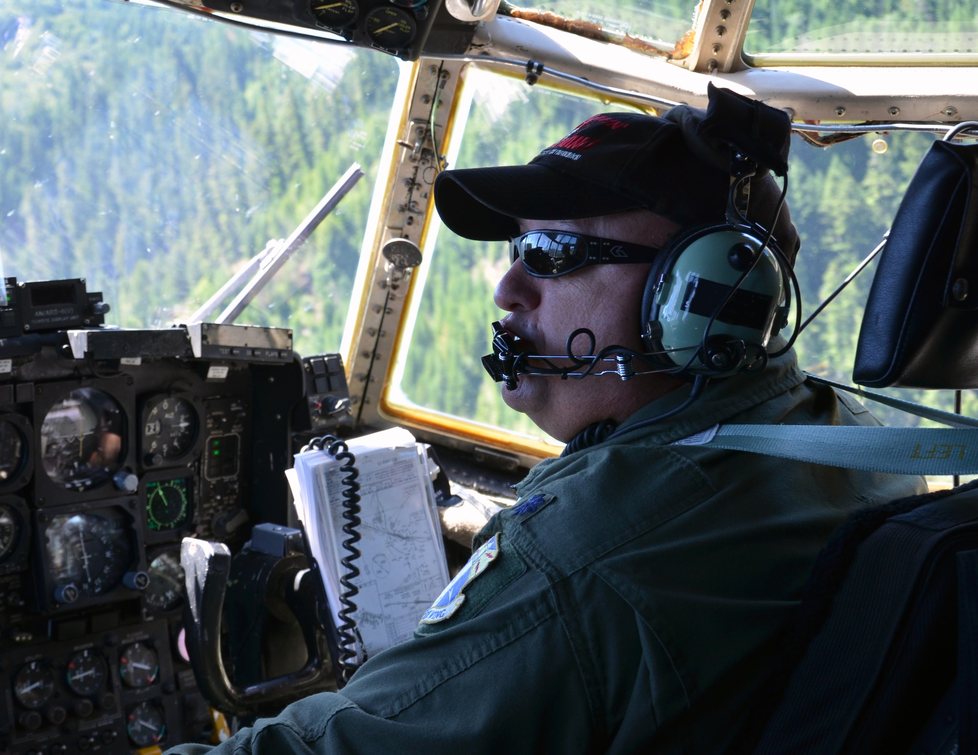 Lt. Col. Antonio Cunha, HC-130P/N King pilot, 920th Rescue Wing, Patrick Air Force Base, Fla., flies a training mission over Portland, Ore., July 27, 2013. (U.S. Air Force Photo/Tech. Sgt. Anna-Marie Wyant)