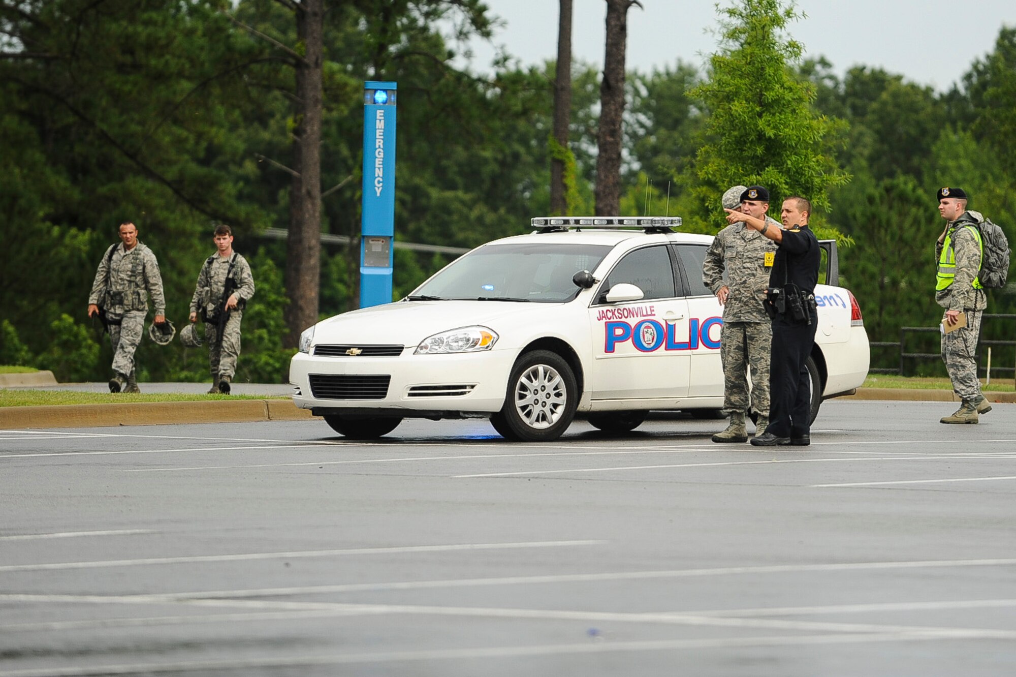 First responders from the base and the Jacksonville Police Department arrive on scene of the Major Accident Response Exercise July 24, 2013, at Little Rock Air Force Base, Ark. The purpose of the MARE was to test the response of the bases and the city of Jacksonville’s first responders. (U.S. Air Force photo by Airman 1st Class Cliffton Dolezal)