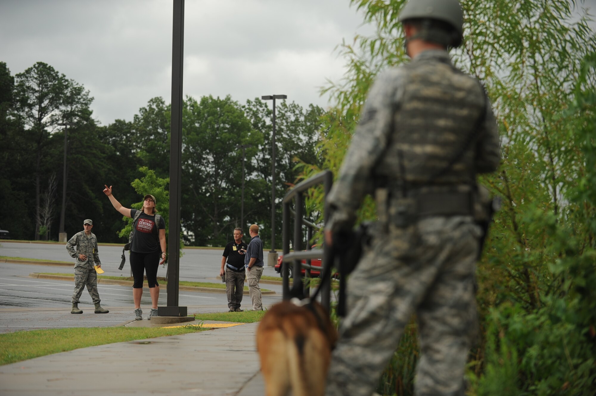 A member of the 19th Security Forces attempts to calm down a simulated enraged student, Capt. Dawn Harnack, a 19th Airlift Wing Inspector General chief of wing exercise’s outside of the Little Rock Education Center during a Major Accident Response Exercise July 24, 2013, at Little Rock Air Force Base, Ark. The purpose of the MARE was to test the response of the bases and the city of Jacksonville’s medical and emergency personnel. (U.S. Air Force photo by Airman 1st Class Cliffton Dolezal)