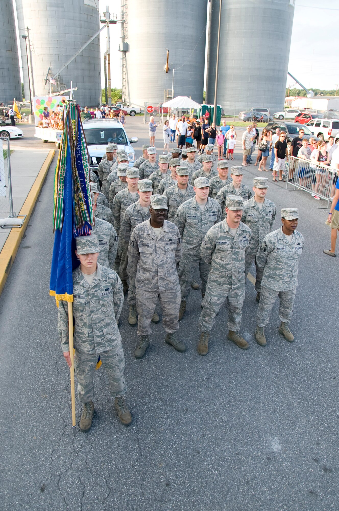 A group of Team Dover Airmen stand in formation July 24, prior to marching in a parade at the Delaware State Fairgrounds in Harrington, Del. More than 30 Airmen volunteered to march in the parade that was part of Armed Forces Day at the Delaware State Fair. (U.S. Air Force photo/Tech. Sgt. Jeremy Larlee)