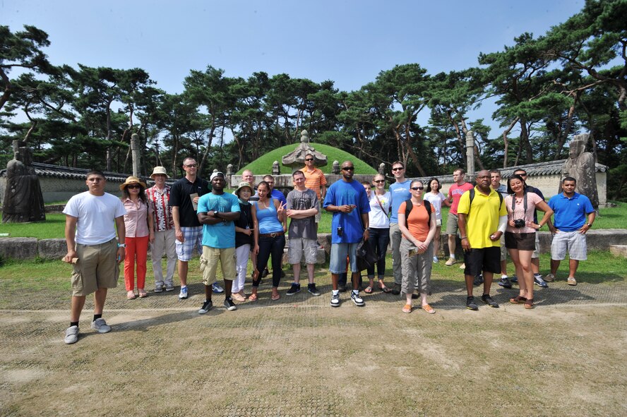 Participants in the Yeoju cultural tour gather together for a group photo at King Sejong’s tomb in the Gyeonggi Province, Republic of Korea, July 26, 2013. King Sejong oversaw the creation of Hangul, encouraged scientific advancements, and instituted many other efforts to stabilize and improve prosperity within the country. (U.S. Air Force photo/Staff Sgt. Emerson Nuñez)