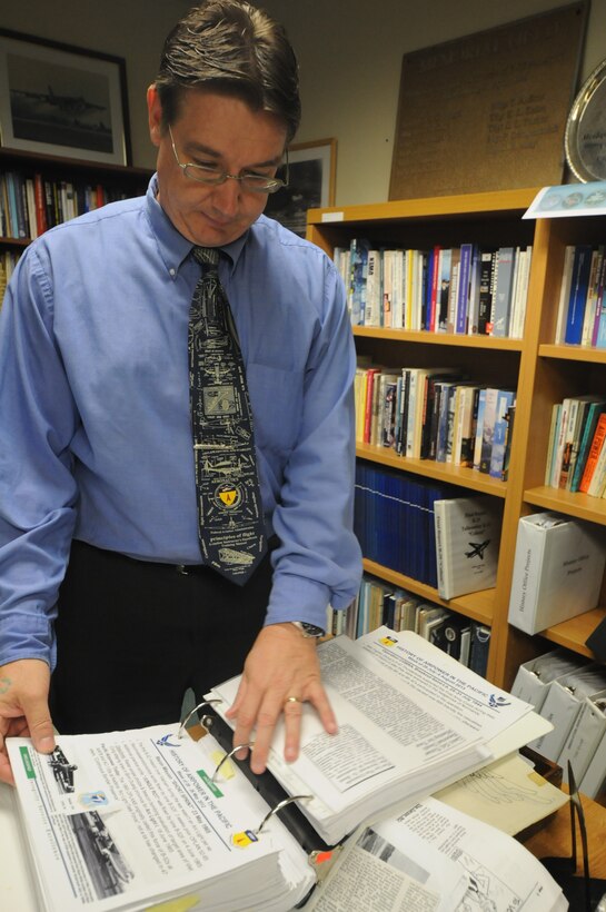 Jeffrey Meyer, 36th Wing Historian, reviews 36th Wing Staff briefings July 30, 2013, on Andersen Air Force Base, Guam. As part of his responsibilities, Meyer produces slides to be used during staff meetings that talk about the history of Andersen’s mission, operations, and organization. (U.S. Air Force photo by Airman 1st Class Amanda Morris/Released)