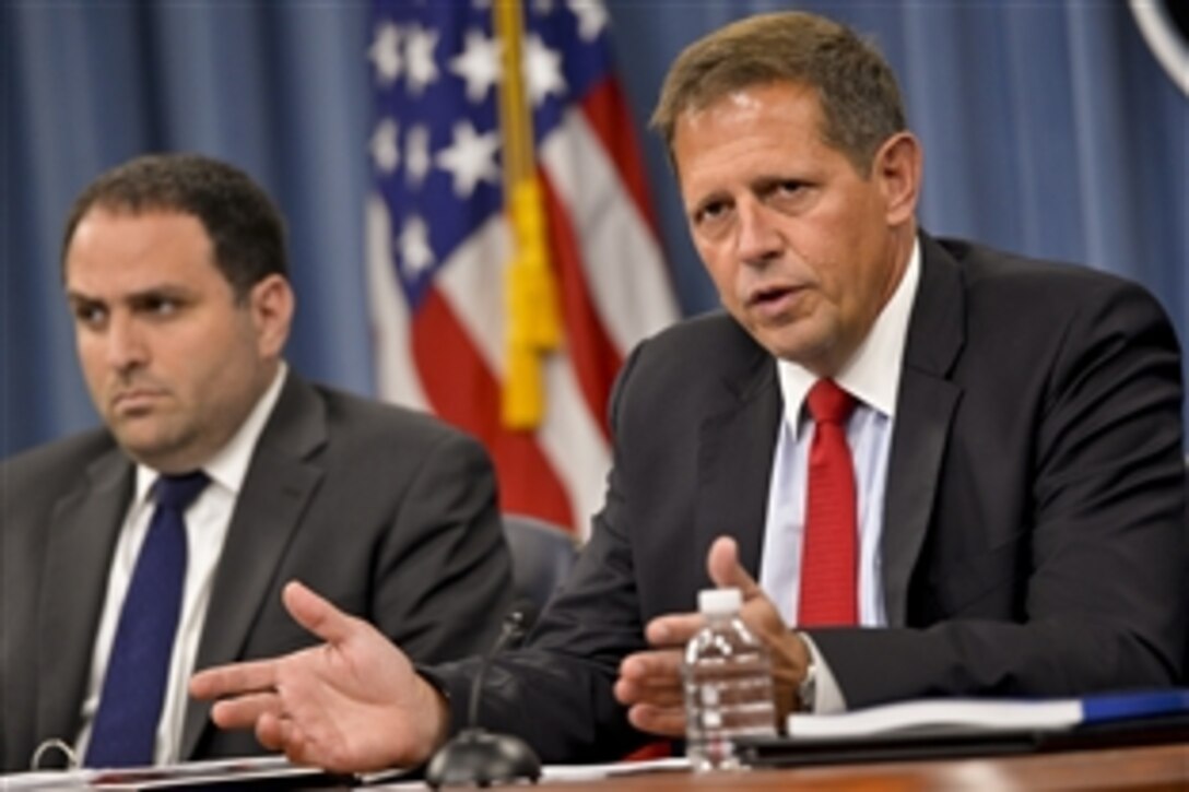 Peter Lavoy, acting assistant defense secretary for Asia Pacific Security Affairs, right, and Jarrett Blanc, deputy to the special representative to Afghanistan and Pakistan, brief reporters at the Pentagon following the release of a biannual report to Congress on progress in Afghanistan, July 30, 2013. 