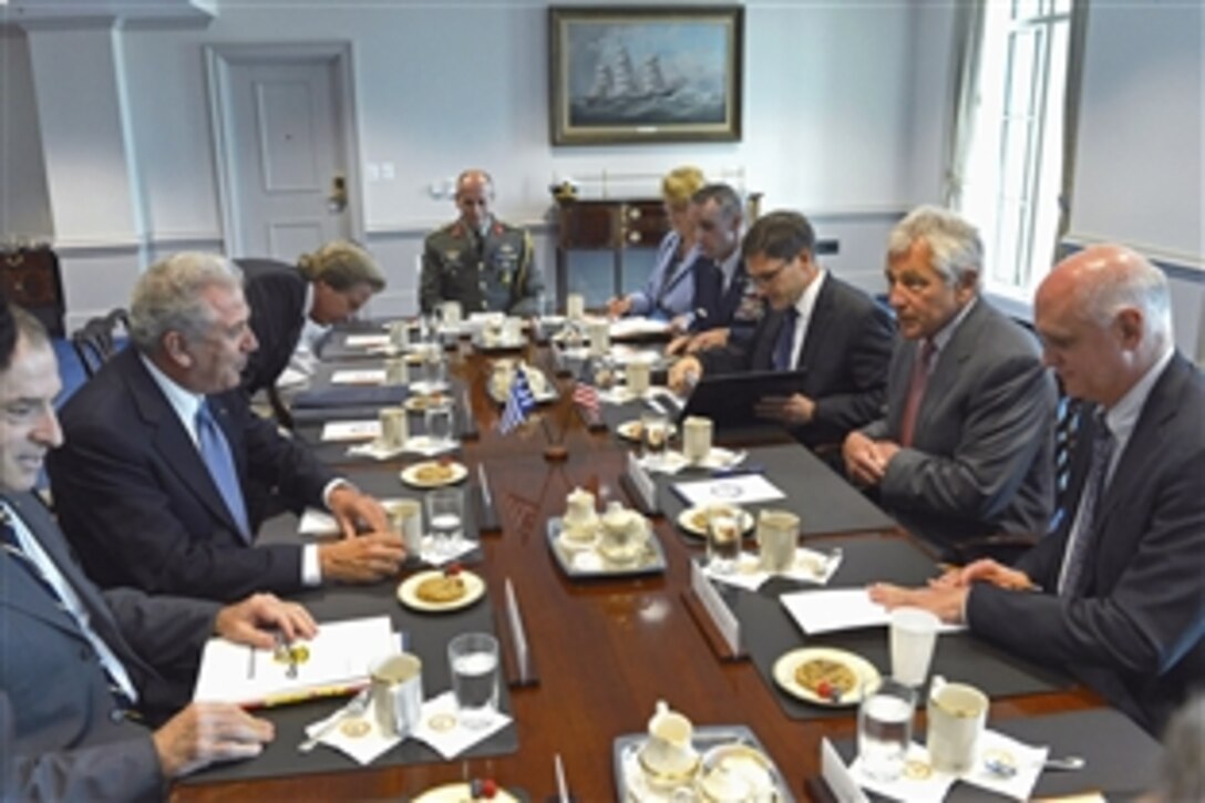 U.S. Defense Secretary Chuck Hagel, second from right, meets with Greek Defense Minister Dimitris Avramopoulos, second from left, at the Pentagon, July 30, 2013. The two leaders discussed topics of mutual concern.
