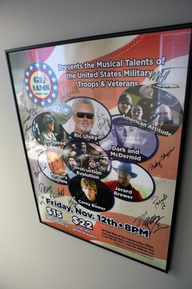 A GI Jams poster hangs in the office of Lt. Col. Jerard A. Brewer, Marine Corps Installations-East Marine For Life officer in charge, aboard Marine Corps Base Camp Lejeune, July 26. The poster features eight artists including Brewer.