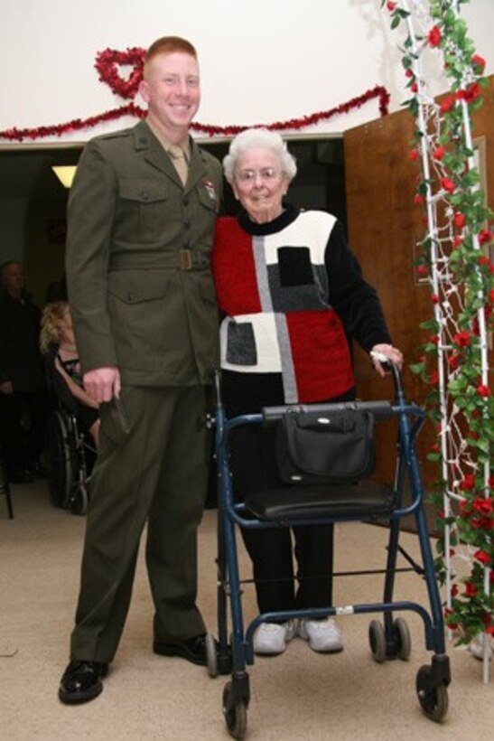 A Single Marine Program volunteer poses with a woman during the Carebridge Senior Citizen Home Dance aboard Marine Corps Base Camp Lejeune recently. The SMP releases new volunteer opportunities weekly.