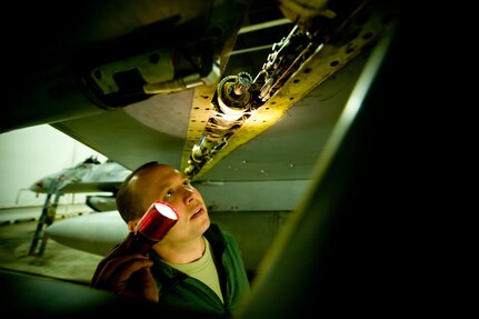 Tech. Sgt. Nathan Bechdolt, 122nd Fighter Wing crewchief, inspects the leading edge flap of an F-16 Fighting Falcon at Misawa Air Base, Japan, March 6. Sergeant Bechdolt is one of 31 Airmen deployed from the Air National Guard deployed to help the 35th Aircraft Maintenance Squadron during a low-manning period.