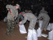 North Dakota National Guard members fill sandbags in response to recent flooding in their state. As of March 23, 2009, more than 250 Soldiers and Airmen from the state have been called out to help stem the flow of floodwaters from the Red River in the Fargo area of the state.