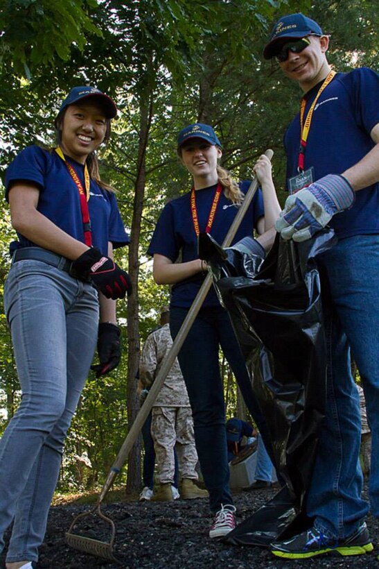 High school students Zoe Want, Alyson Benoit and Ryan Caldwell participate in a service project at the Quantico National Cemetery, June 26. The three students were participants of the second Summer Leadership and Character Development Academy aboard and around Marine Corps Base Quantico, Va., July 21 – 27. 