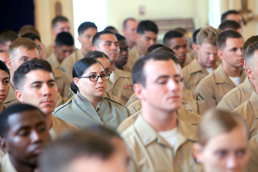 Marines, friends and family attend the memorial service of Gunnery Sgt. Konstantin Klyaz, with 1st Intelligence Battalion, at the 11 Area Chapel at Camp Pendleton, Calif., July 26.