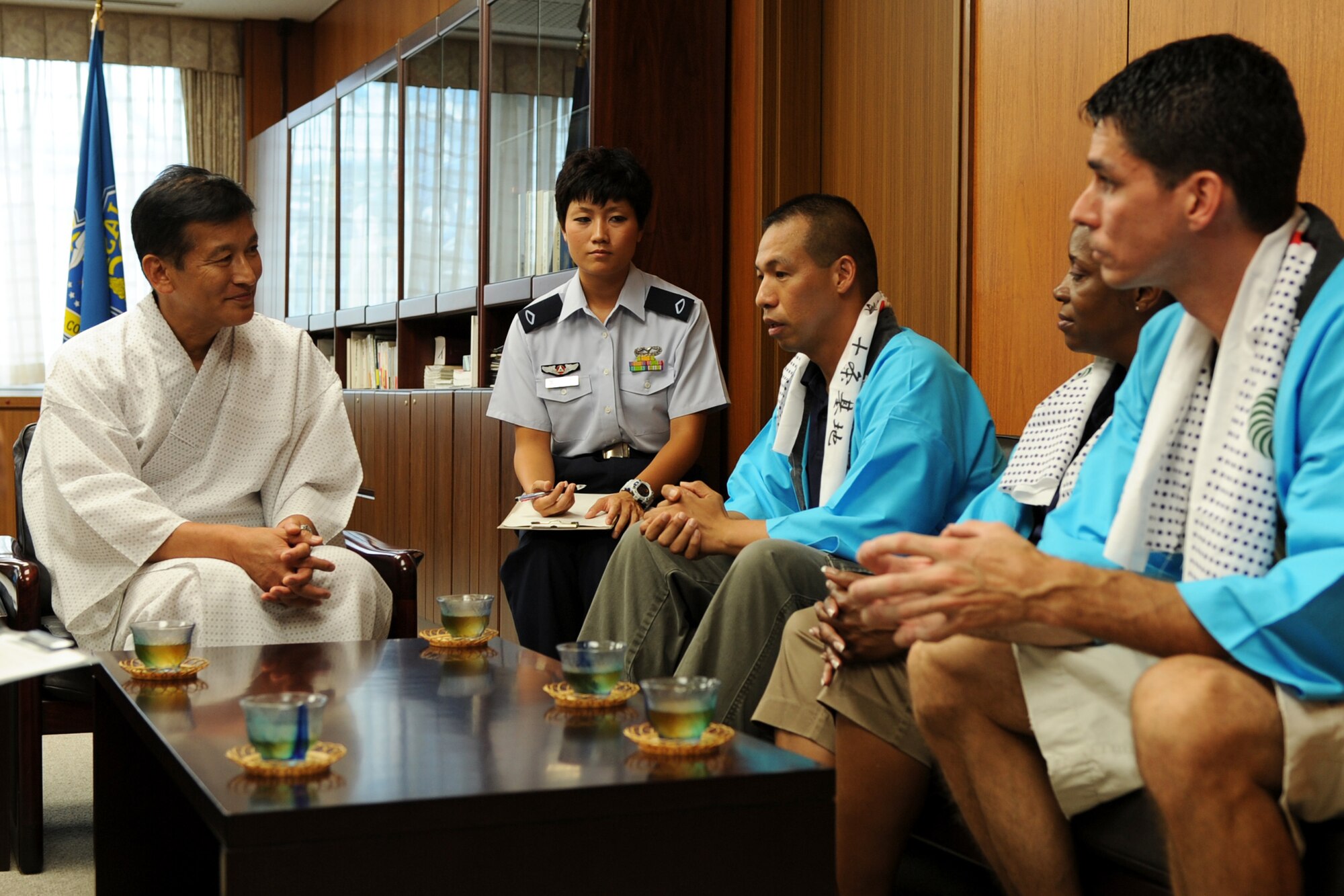 JUJO AIR STATION, Japan -- Left, Lt. Gen. Hideyuki Yoshioka, Air Materiel Command commander, met with enlisted leadership from the 374th Airlift Wing July 26, 2013, at JASDF AMC, Jujo Air Station, Japan. The leaders had a brief conversation before enjoying the bon-dance festival. (U.S. Air Force photo by Senior Airman Desiree Economides)