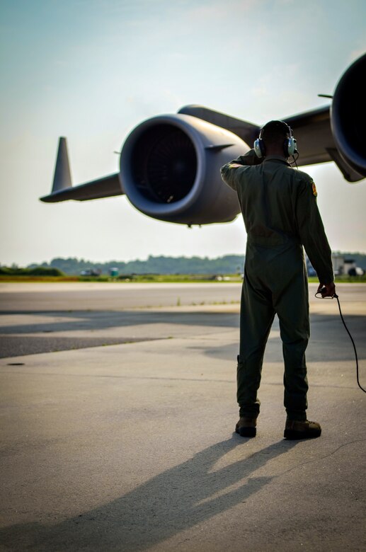 Airman 1st Class Trae Williams, 16th Airlift Squadron loadmaster, inspects the engines of a C-17 Globemaster III as pilots perform pre-flight engine checks July, 30, 2013, at Joint Base Charleston– Air Base, S.C. (U.S. Air Force photo/Airman 1st Class Michael Reeves)