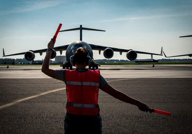 Senior Airman Brandi Barentine, 437th Aircraft Maintenance Squadron crew chief, marshals a C-17 Globemaster III July, 30, 2013, at Joint Base Charleston – Air Base, S.C. (U.S. Air Force photo/ Senior Airman Dennis Sloan)