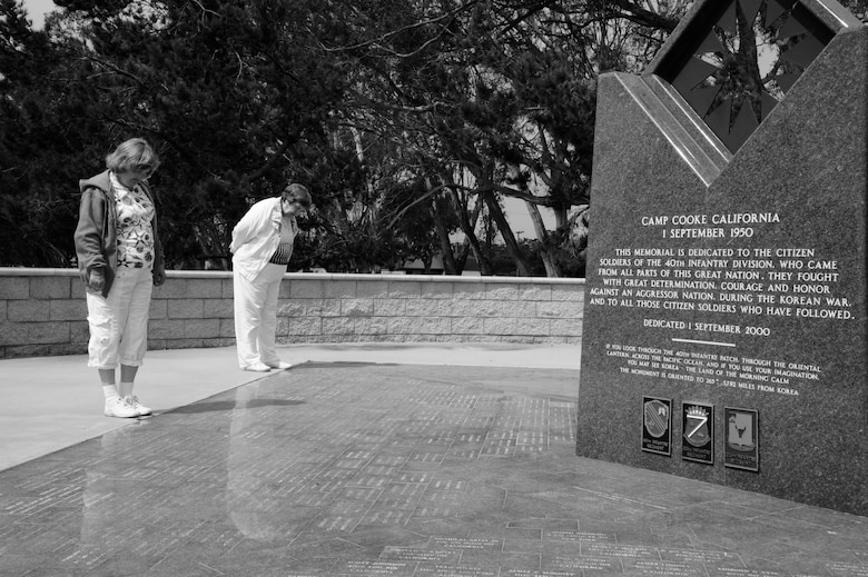 VANDENBERG AIR FORCE BASE, Calif. – Ruby and Janet Cacy, widow and daughter of U.S. Army former Staff Sgt. Kenneth Cacy of the 40th Infantry Division of the California National Guard, reads names from the bricks around the Korean War Memorial here Thursday, July 25, 2013. July 27, 1953 marked the end of the Korean conflict, it has been almost 60 years since Ruby stepped foot onto Vandenberg Air Force Base, which was still operating as Camp Cook when she and her husband were previously stationed here. (U.S. Air Force photo / Senior Airman Lael Huss)