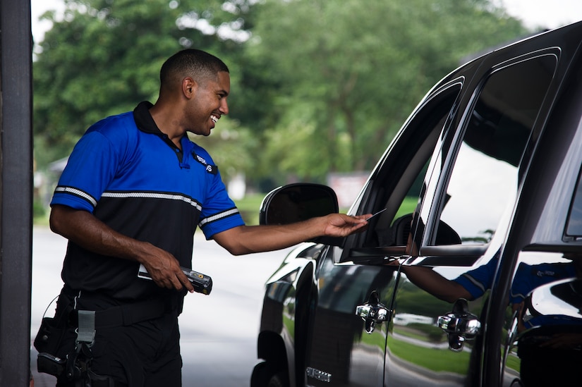 Staff Sgt. William Barrios, 628th Security Forces Squadron patrolman, checks an identification card July 30, 2013, at the front gate of Joint Base Charleston – Air Base, S.C. Barrios still performs the regular duties of a Security Forces patrolman along with performing bike patrols. The 628th SFS Bike Patrol program was implemented to build a better relationship between 628th SFS members and the community they protect. (U.S. Air Force photo/Staff Sgt. Rasheen Douglas)