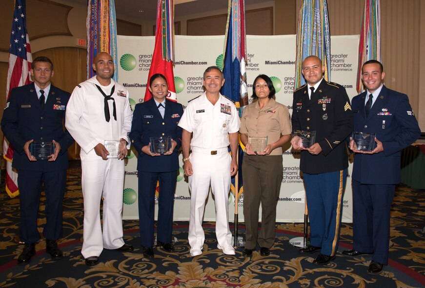 Members of the Greater Miami Chamber of Commerce honored Senior Airman Anthony Alvarez (far right), 482nd Aircraft Maintenance Squadron, by naming him one of their Military Persons of the Year during their 26th Annual Military Person of the Year Awards at Jungle Island in Miami July 10. The awards recognize south Florida military personnel for their accomplishments. Navy Vice Adm. Harry B. Harris, Jr., (center), Assistant to the Chairman, Joint Chiefs of Staff, was the keynote speaker during the ceremony. (courtesy photo)