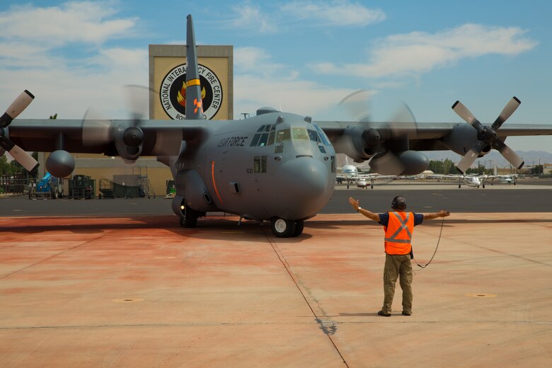 A Modular Airborne Fire Fighting System-equpped C-130 from the 153rd Airlift Wing prepares to take off in Boise, Idaho on July 28, 2013. Wyoming and North Carolina Air National Guard units are currently based at Boise in support of MAFFS missions. (U.S. Air National Guard photo by Tech. Sgt. Jeffrey Allred)