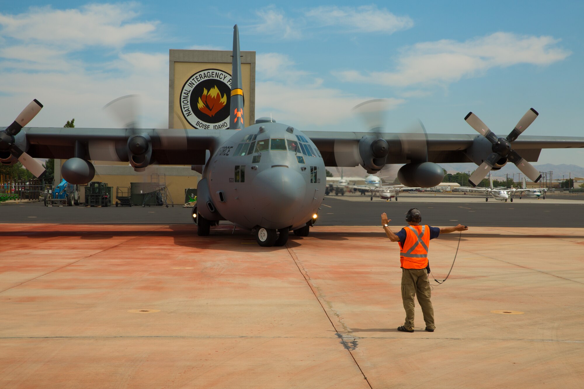 A Modular Airborne Fire Fighting System-equpped C-130 from the 153rd Airlift Wing prepares to take off in Boise, Idaho on July 28, 2013. Wyoming and North Carolina Air National Guard units are currently based at Boise in support of MAFFS missions. (U.S. Air National Guard photo by Tech. Sgt. Jeffrey Allred)