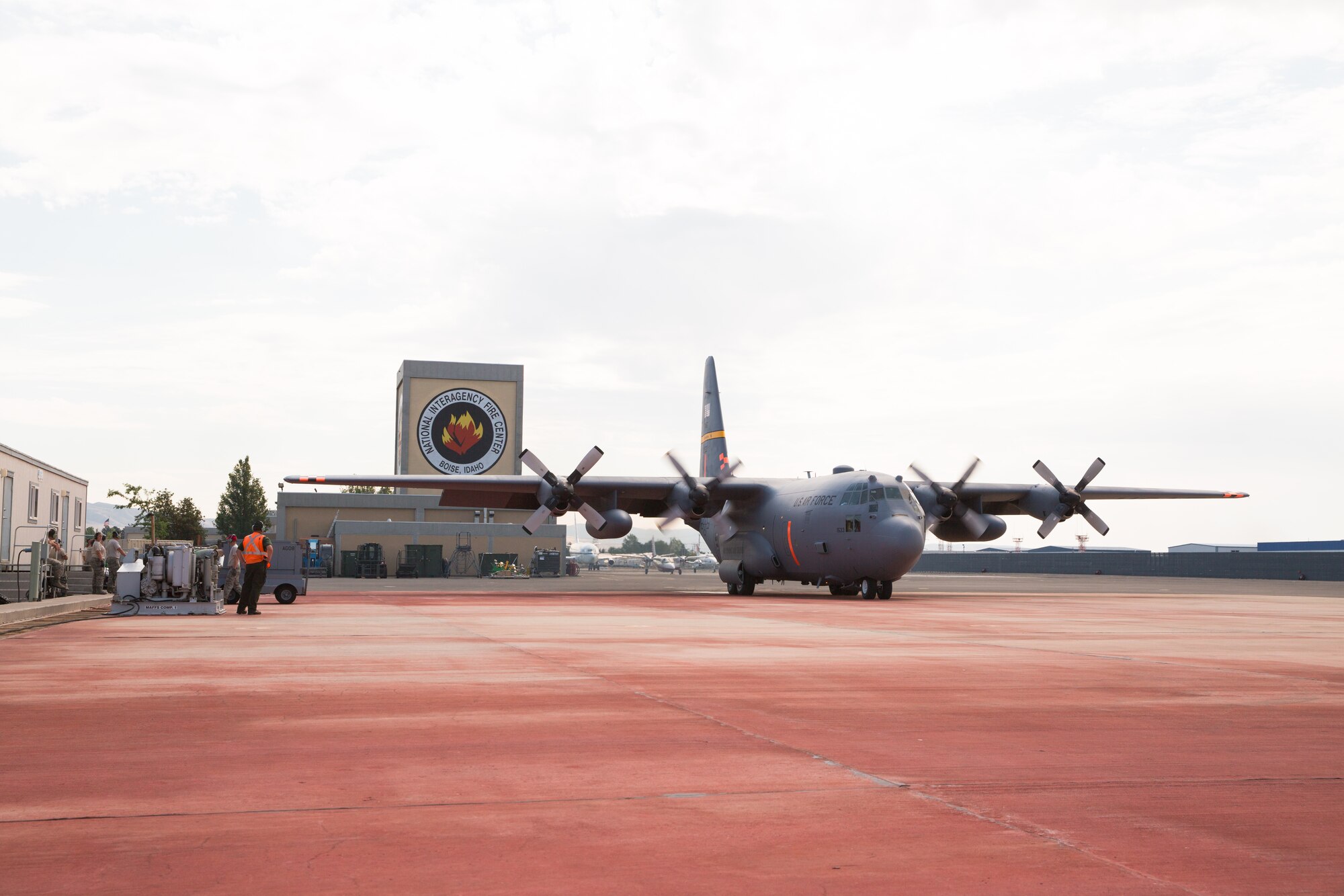 A Modular Airborne Fire Fighting System-equpped C-130 from the 153rd Airlift Wing prepares to take off in Boise, Idaho on July 28, 2013. Wyoming and North Carolina Air National Guard units are currently based at Boise in support of MAFFS missions. (U.S. Air National Guard photo by Tech. Sgt. Jeffrey Allred)